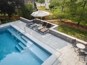 Patio furniture around fiberglass pool
